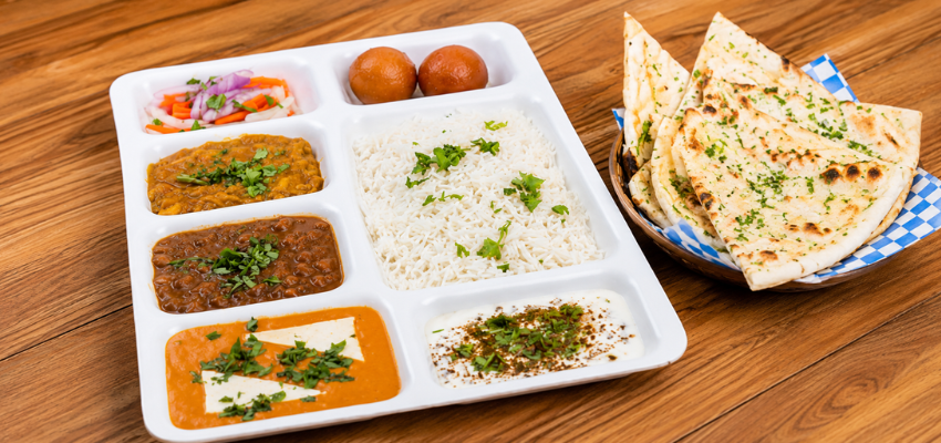 Indian thali platter with curries, rice, bread and dessert at Sifat Indian Cuisine Windsor